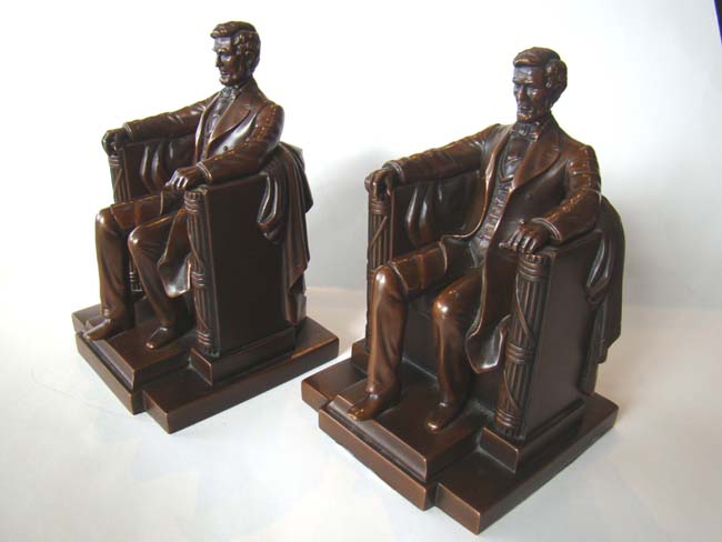 A FABULOUS and early pair of "Lincoln in the chair" bookends by Jennings Brothers circa 1923